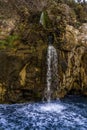 Water cascades into the Gulf of Naples from the ruins of a Roman aqueduct on the Sorrento Peninsula, Italy Royalty Free Stock Photo