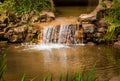 Water cascades over a man made water fall