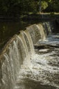 Water cascading down small waterfall on Blackstone River Royalty Free Stock Photo