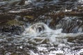 Water cascading over a rock in willard brook Royalty Free Stock Photo