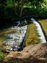 Water cascading over weir Royalty Free Stock Photo