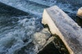 Water Cascading over Weir Step in river canal. Royalty Free Stock Photo