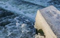 Water Cascading over Weir Step in river canal. Royalty Free Stock Photo