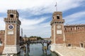 Water channel and entrance gate to Venetian Arsenal in Italy Royalty Free Stock Photo