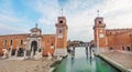 Water channel and entrance gate to Venetian Arsenal Royalty Free Stock Photo