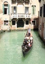 Water channel with gondola in Venice