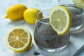 Water with chia seeds and lemon on a white background. A useful drink for weight loss. Royalty Free Stock Photo