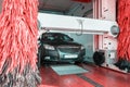 Water clean auto car on carwash hand service. Vehicle wash from soap, foam on cleaner station. Automatic care, waxing.