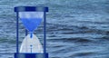 water clock on sea wave background close-up Royalty Free Stock Photo