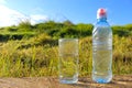 Water. Cold mineral water in a glass beaker and plastic water bottle Royalty Free Stock Photo