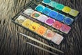 Water color paint box and paint brush Royalty Free Stock Photo