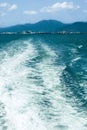 water is coming from the back of a boat in the ocean Royalty Free Stock Photo