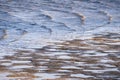 Water coming in at high tide and covering the muddy shores of San Francisco Bay Area, California