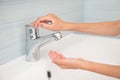 No water consumption lack concept of little kid hand opening stainless empty mixer tap faucet in bathroom