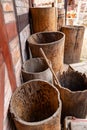 Water containers made of wood. Old barrels carved from the trunk of a tree