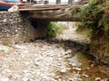 Water in creek canal and irrigation reservoir evaporated lost in drought dry season at countryside rural hill valley village in