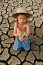 Water crisis child hold small tree