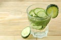 Water with cucumber. Refreshing diet water with cucumber and mint in a glass beaker against a blue background. detox drink concept Royalty Free Stock Photo