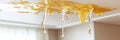 Water Damage On Ceiling, Leaking Roof Causing Home Interior Damage, Home Repair Issues and Concept Royalty Free Stock Photo
