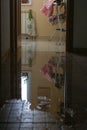 Water damage due a broken pipe. Moisture problem and wet floor. Vertical, selective focus Royalty Free Stock Photo