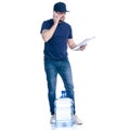 Water delivery man in blue t-shirt and cap with smartphone and document invoice signature