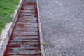 Water drain or ditch metal grid on the road