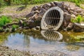 Water drainage pipe prevening from flooding land Royalty Free Stock Photo
