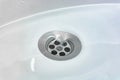 Water drains whirly in the wash sink in the bathroom Royalty Free Stock Photo