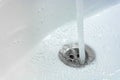 Water drains whirly in the wash sink in the bathroom Royalty Free Stock Photo