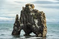 Water drinking lava formation in Huna bay, on northern Iceland Royalty Free Stock Photo