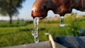 Water dripping from old leaky tap Royalty Free Stock Photo