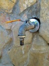 Water dripping from outdoor spigot Royalty Free Stock Photo