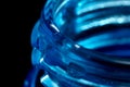 Water drop on blue plastic bottle, neck with a thread, macro Royalty Free Stock Photo