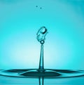 Water Drop Collisions Macro Photography with blue background