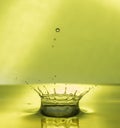 Water Drop Collisions Macro Photography with green background Royalty Free Stock Photo