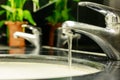 Water drop from dirty faucet in bathroom or toilet. Water saving Royalty Free Stock Photo