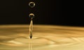 Water drop fall down and splash on surface Royalty Free Stock Photo