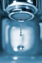 Water drop from a faucet Royalty Free Stock Photo