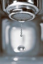 Water drop from a faucet Royalty Free Stock Photo