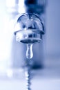 Water drop from a faucet Royalty Free Stock Photo