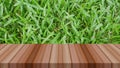 Water drop on grass and wooden table for product display Royalty Free Stock Photo