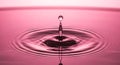 Water Drop Impact: Pink Liquid Creates Ripples, Abstract Art Royalty Free Stock Photo