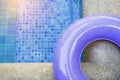 Water drop on part of purple ring pool Royalty Free Stock Photo