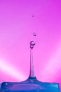 Water Drop Collisions Macro Photography with pink background