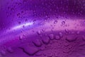 Water drop in purple background selective focus Royalty Free Stock Photo