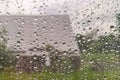 Water drop of rain on window glass burred garden Royalty Free Stock Photo
