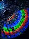 Water drop rainbow in the cd full of color red orange yellow green blue purple Royalty Free Stock Photo