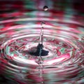 Water drop in sunlight,colorful red Royalty Free Stock Photo