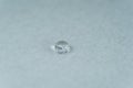 water drop on top of white fabric sheet Royalty Free Stock Photo