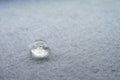 water drop on top of white fabric sheet Royalty Free Stock Photo